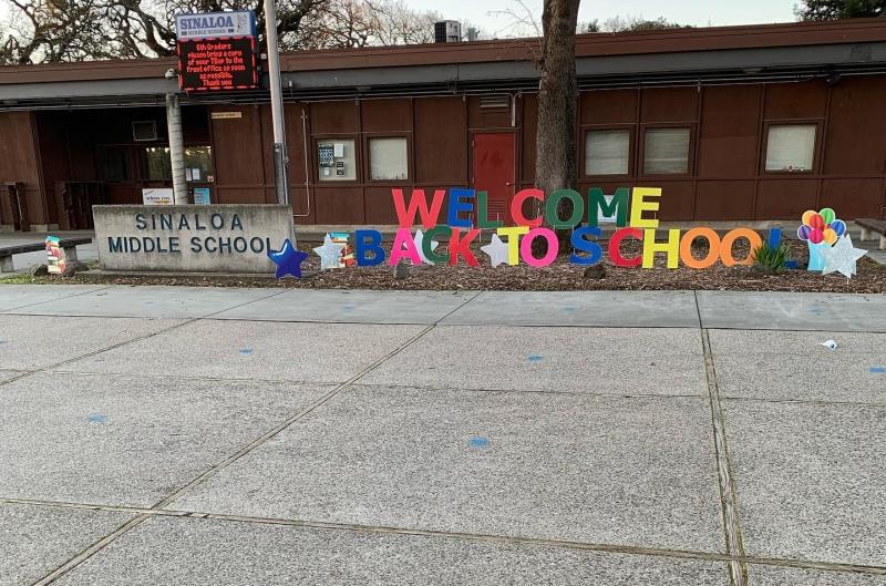 welcome back sign in front of school